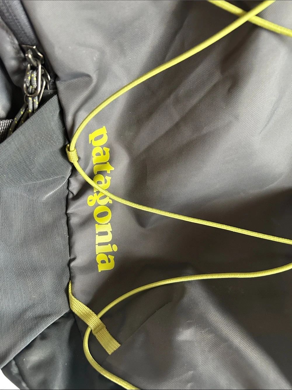 Patagonia Gray Backpack with Yellow Bungee Accents